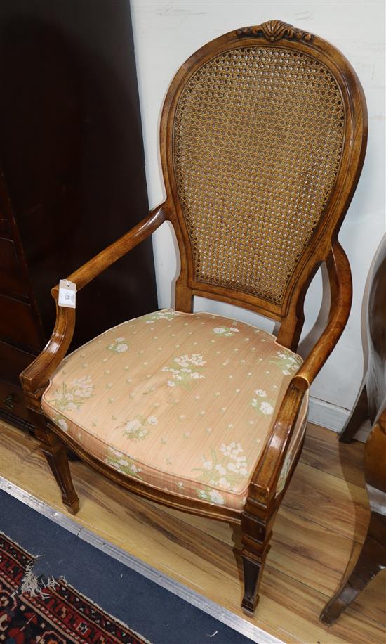 A set of ten caned back walnut dining chairs (two with arms)